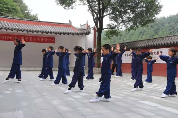 students learning kung fu in the courtyard of wudang kungfu academy
