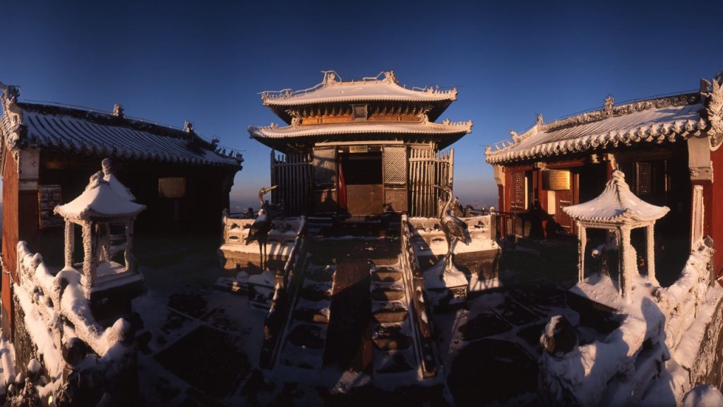 A front-facing wide shot of the Golden Palace courtyard at the absolute peak of Tianzhu Mountain